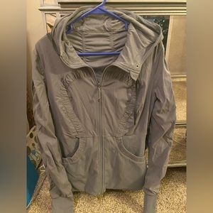 Lululemon zip up jacket with hood.